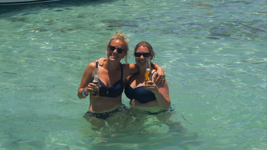 relaxing time with a beer in the beautiful warm waters of Isla Mujeres