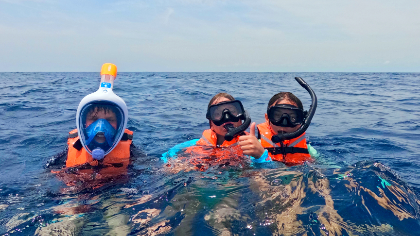 Kids at the whale shark tour with masks and snorkel Kids at the whale shark tour with masks and snorkel