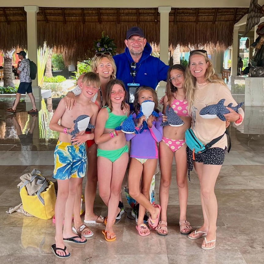 Fun with the family, all kids with a whale shark plushie